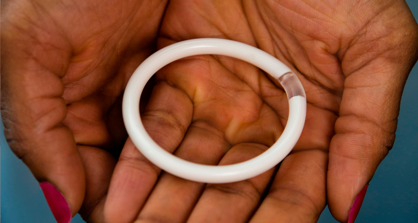 A vaginal ring in a woman's palms.