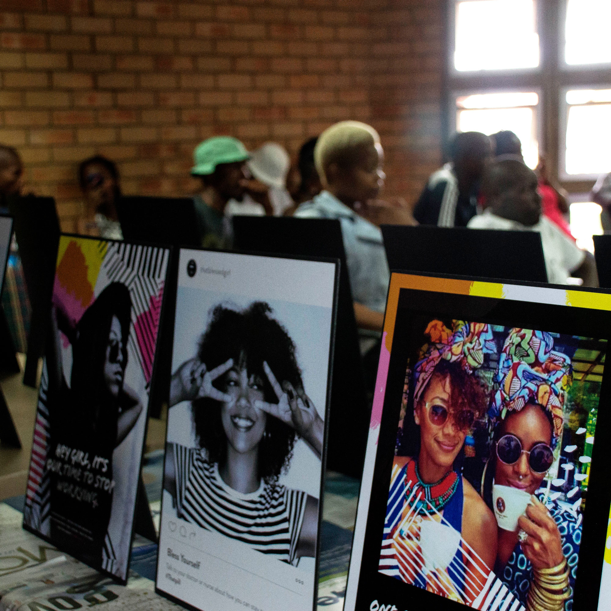 table with framed posters